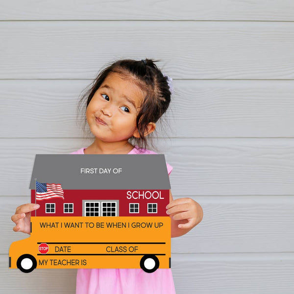 Kids First Day of School Sign | School Bus - Books & Activities - Poshinate Kiddos Baby & Kids Store - child holding sign